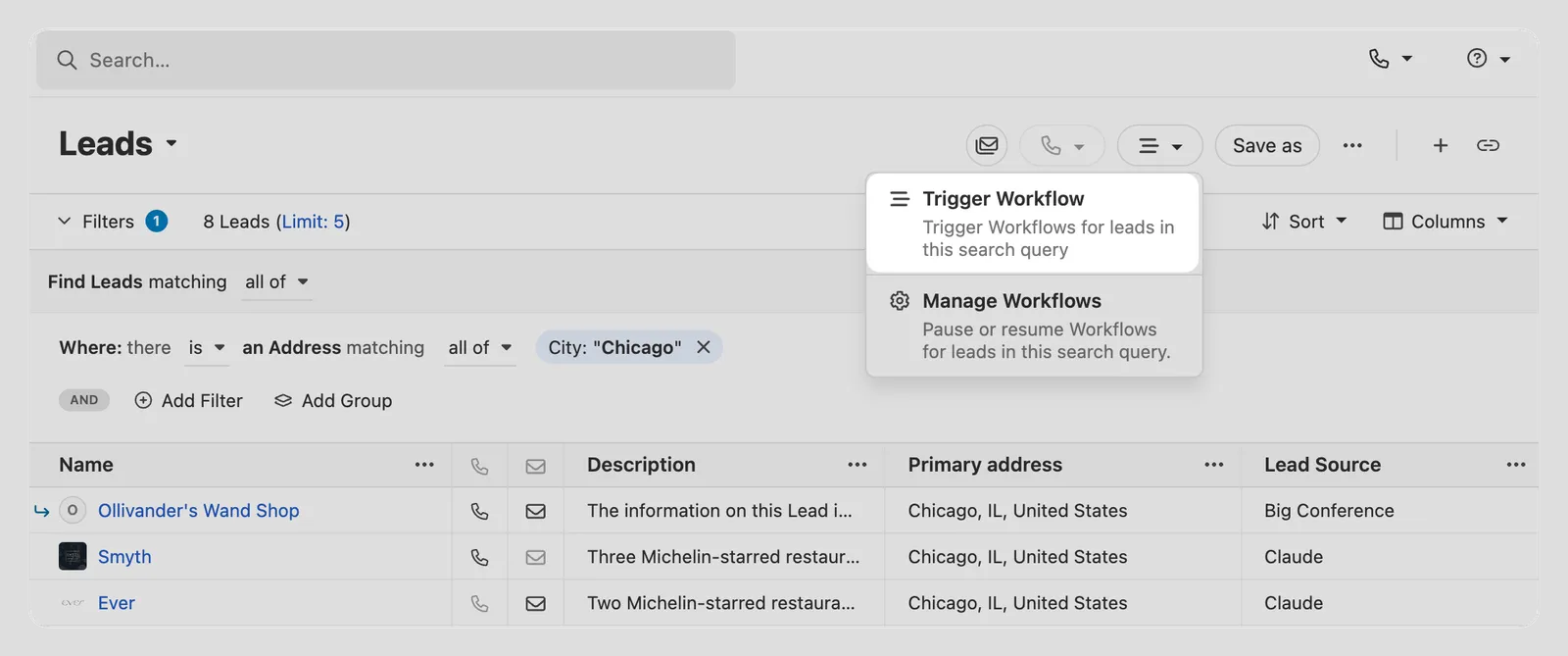 Leads list with a filter for Chicago and an open dropdown showing Trigger Workflow and Manage Workflows options.