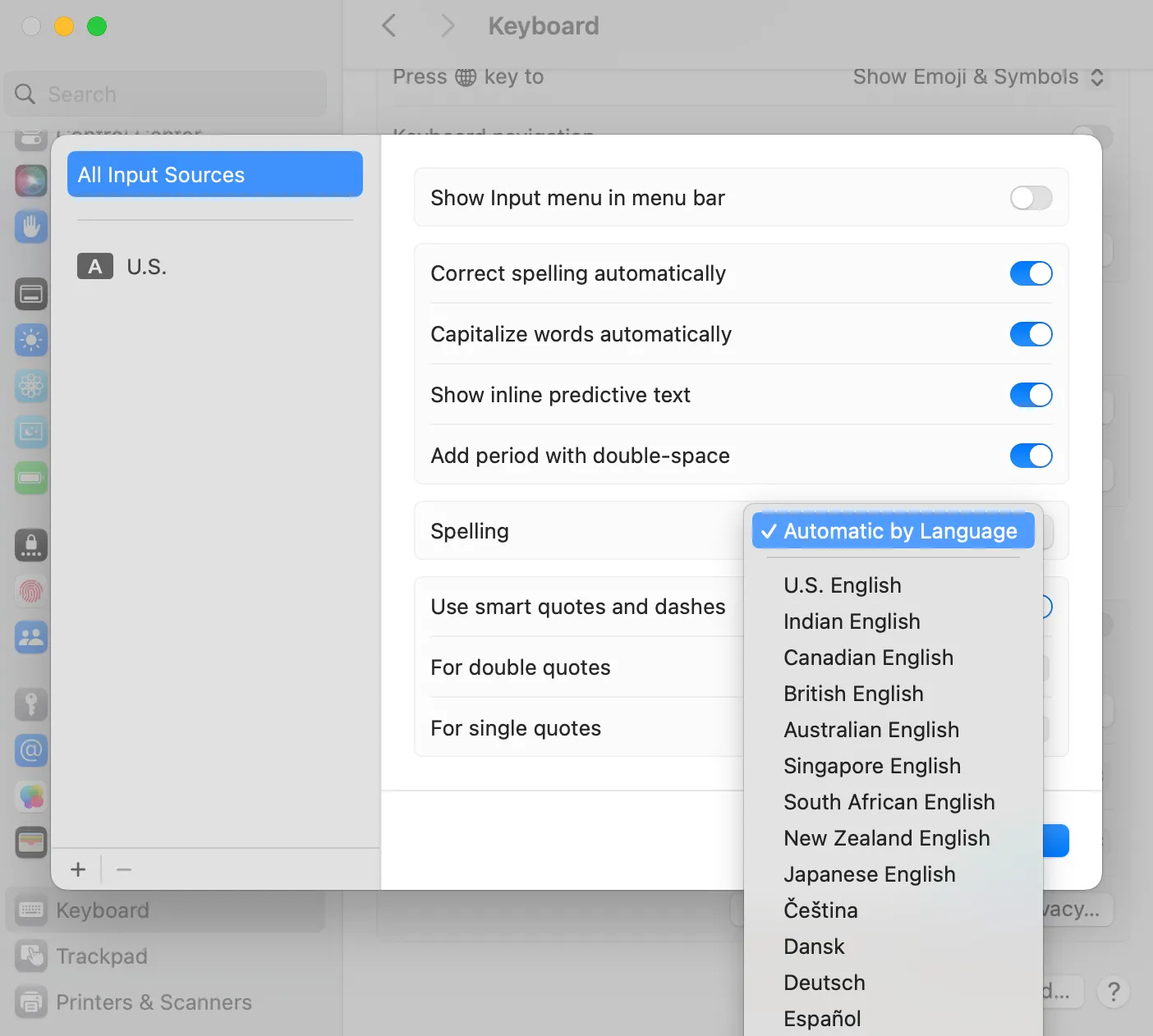 macOS Keyboard preferences showing spelling options with a language dropdown set to Automatic by Language.